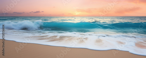 Calm and paradisiacal Caribbean beach during sunset. Sunny sea shore with foamy water and waves. Beautiful and serene beach in soft pastel pink and turquoise tones. Summertime and holidays concept.