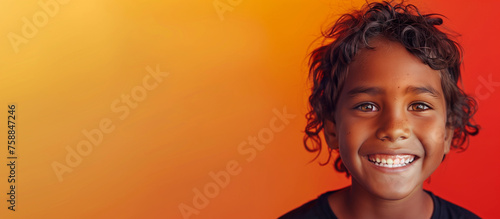 One happy 10 yr old boy student Indigenous Aboriginal Australian kid curls hair black skin diverse positive portrait isolated first nation dreamtime child education reconciliation equality copy space
