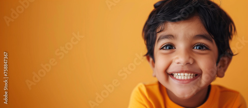 One happy 5 yr old boy student Indian kid short hair skin diverse positive portrait isolated child dental oral health childcare happiness celebrate joyful vibrant South Asia India concept copy space 