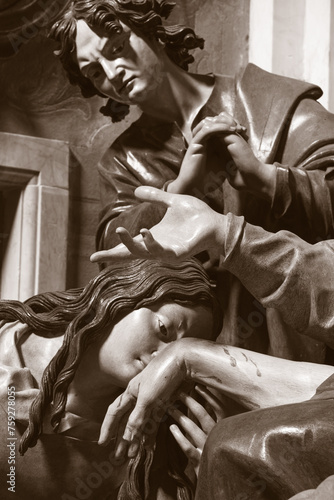 GENOVA, ITALY - MARCH 8, 2023: The detail of carved polychrome sculptural group of Pieta in the church Chiesa di san Filippo Neri by Anton Maria Maragliano (1664 - 1739).