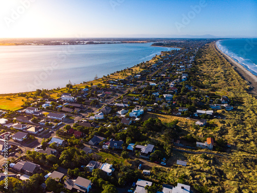 aerial panorama of christchurch city, new brighton beach, southshore and sumner beach at sunset; 