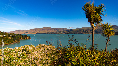 panorama of cass bay and banks peninsula as seen from pony point; famous coastal walk near christchurch and lyttelton, canterbury, new zealand south island