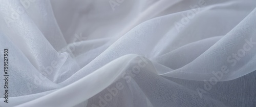 Folds of ghostly thin silver fabric