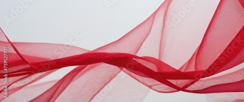 Bright and delicate descending folds of red fabric