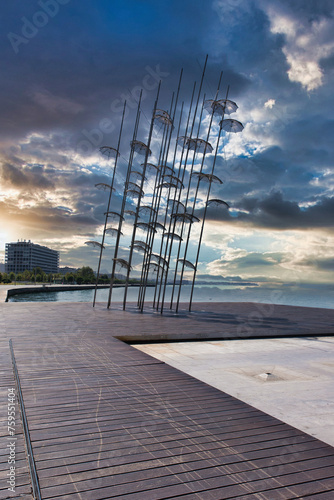 thessaloniki town greece cloudy sky on the beach road sculpture with umbrellas