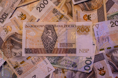 two bundles of money - 200 and 100 PLN