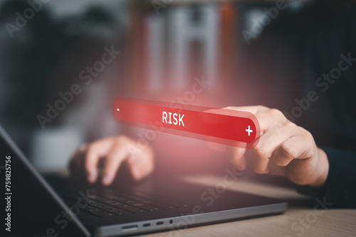 Business risk control and strategy management. Hand point on red bar of business risk level , decision making and risk crisis analysis. Measuring risky level bar virtual.