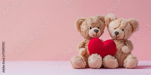 Two teddy bears sitting side by side, each holding a heart in their paws.