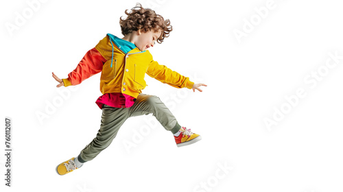 A young boy jumps joyfully in the air