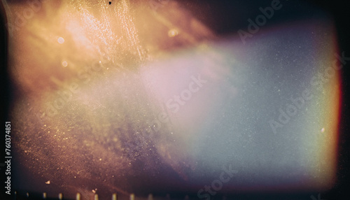 Abstract film texture background with grain, dust and light leaks; artistic image of the camera