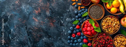 Colorful assortment of healthy superfoods on dark background