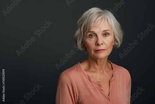 Modern elder woman with short hair standing proud