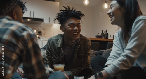 Youthful Asian male enjoying a lively discussion with diverse friends over mocktails in a contemporary home, highlighting inclusivity and alcohol-free trends