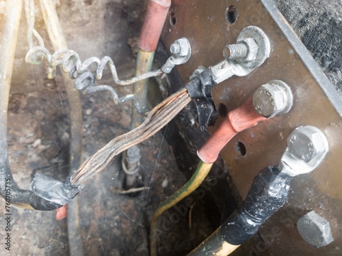 Burnt ground cable, failure in the industrial electrical installation grounding system. Failure earth system concept.