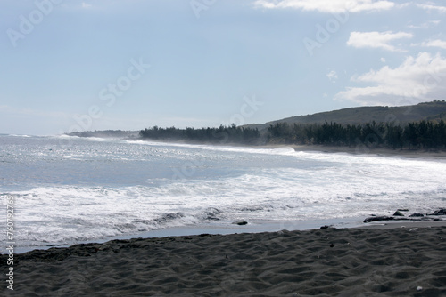 A photo of beach with black sand