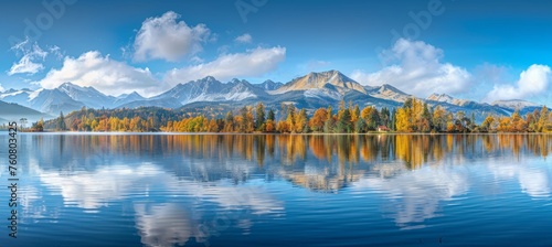 Autumn high tatra lake stunning mountain view with sunlit pine forest for serene hiking