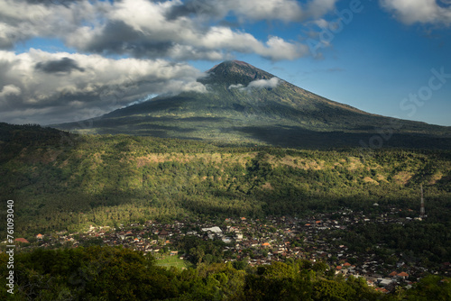 Famous Mount Agung volcano and Culik Village viewpoint during sunny day and blue sky in Amed, Karangasem, Bali, Indonesia