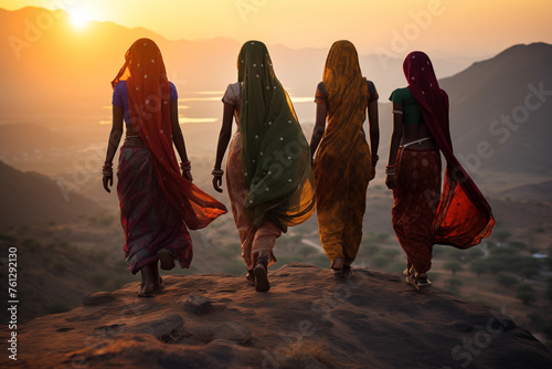 Indian women in colorful sari on top of hill