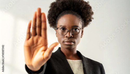 Close-up of an African American woman with her hand outstretched as a sign of stop against violence. Concept to stop sexual harassment and violence against women. Generative Ai.