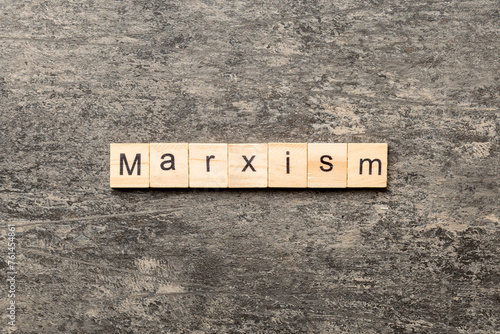 marxism word written on wood block. marxism text on table, concept