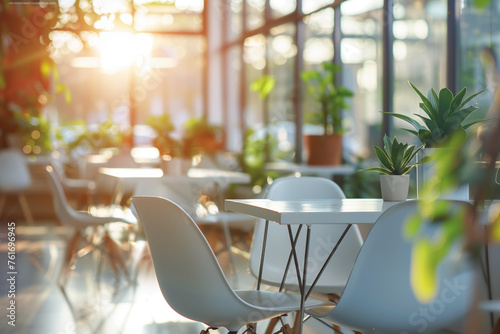 Modern office or restaurant interior with white chairs and tables, large windows, plants in pots on the tables