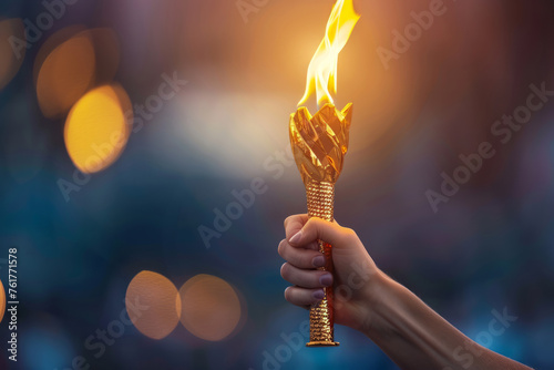 Powerful image showcasing a hand proudly holding the Olympic torch, representing the pinnacle of sporting excellence. Suitable for sports publications, motivational content