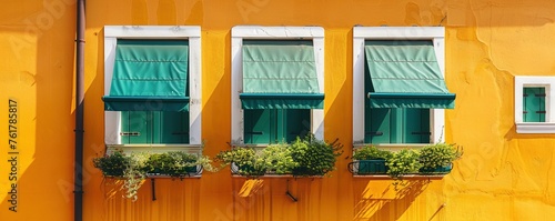 stylish yellow and orange building facade with green window shades