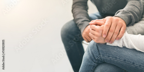 Man counseling desperate woman at group therapy session