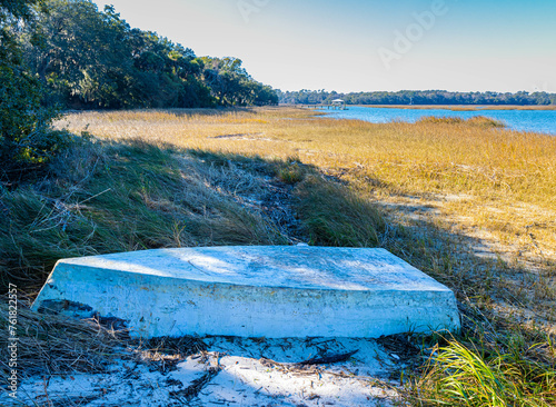 Small Boat on The Shore of Skull Creek at The Pope Squire Community Park, Hilton Head, South Carolina, USA