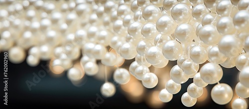Elegant White Pearls Cascading From the Ceiling in a Luxurious Display