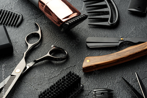 Set of tools for hairdressing and barbershop on gray background