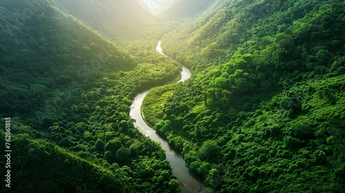 A winding river cutting through a lush green valley