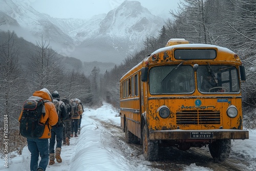 Adventurous hikers trek past a derelict school bus in a snowy winter landscape