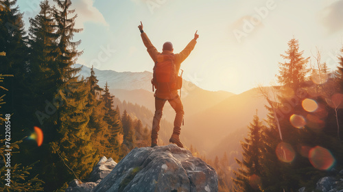 Happy man with arms up jumping on the top of the mountain - Successful hiker celebrating success on the cliff - Life style concept with young male climbing in the forest