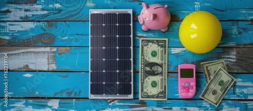 Solar panels, piggy bank and dollar bills against grey background with vignette