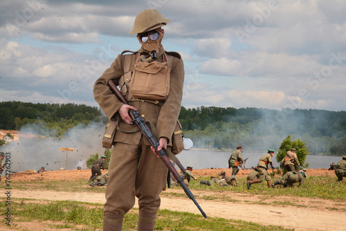 Collage with soldier with gun on background of attack in WWI military show