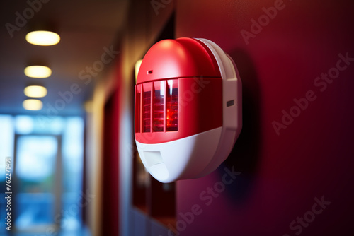 Wall mounted fire alarm detector with strobe light for visual alert, empty space