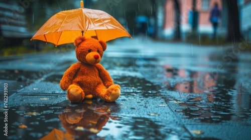 Sad, lonely teddy bear under an umbrella on a wet sidewalk, reflection in puddles, rainy day, solitude.