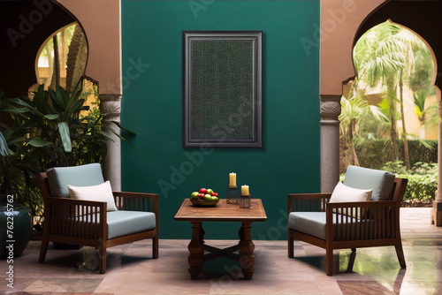 arabic style courtyard with green walls and two chairs and a table