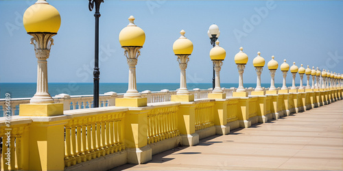 Yellow lamps and balusters of the promenade along the seafront