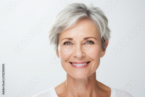 Portrait of a happy woman who has undergone blepharoplasty isolated on white background