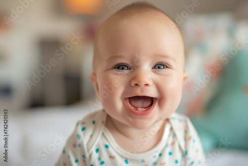 Close-up of a smiling baby with blue eyes, exuding happiness