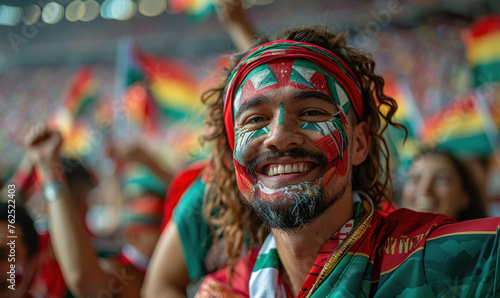 Vibrant Portrait of a Joyful male Hungary Supporter with a Hungarian Flag Painted on His Face, Celebrating at UEFA EURO 2024