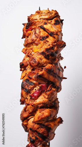 shawarma Grilled skewered chicken on spit isolated on grey background
