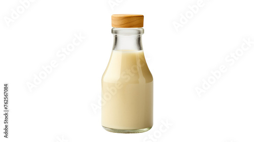 A glass bottle filled with milk, standing elegantly on a white background