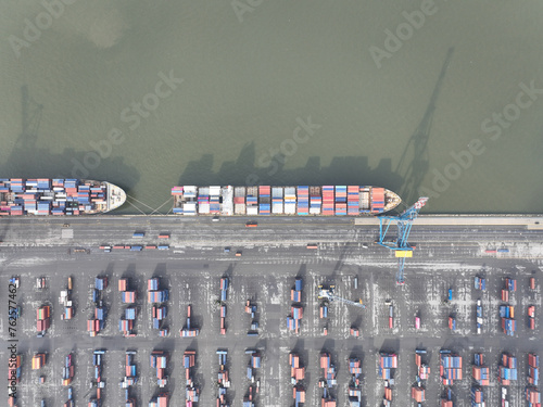 Aerial top down on container ship in the port of Antwerp, Belgium. Port full of containers rady for loading and unloading.
