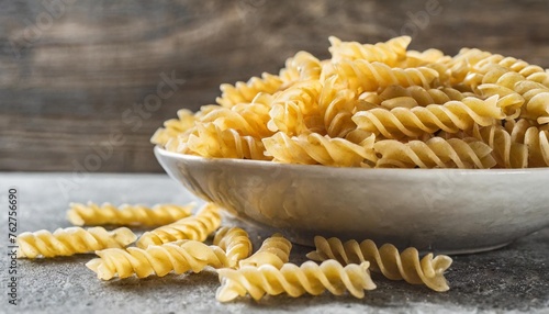 uncooked fusilli pasta uncooked italian pasta on kitchen table