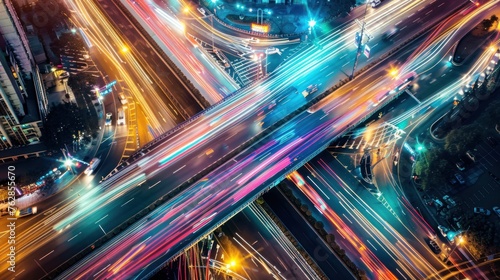 Aerial view of Road Traffic jam on multiple lane highway with speed light trail from car background, Expressway road junction in metropolis city center at night scene 