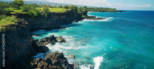 Aerial view of clean turquoise ocean waves crashing against rugged rocks