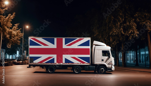 United Kingdom flag on the back of white truck against the backdrop of the city. Truck, transport, freight transport. Freight and Logistics Concept